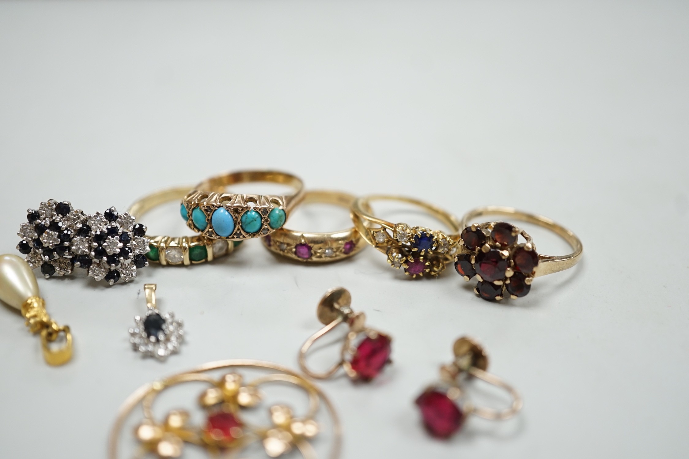 Five assorted 9k and gem set rings including ruby and diamond gypsy set and other jewellery.